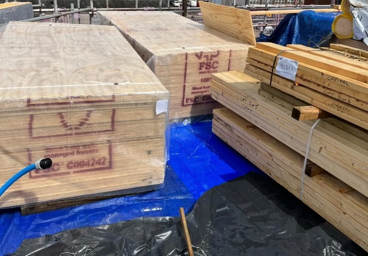 Timber materials delivered to site for a bespoke garden room build