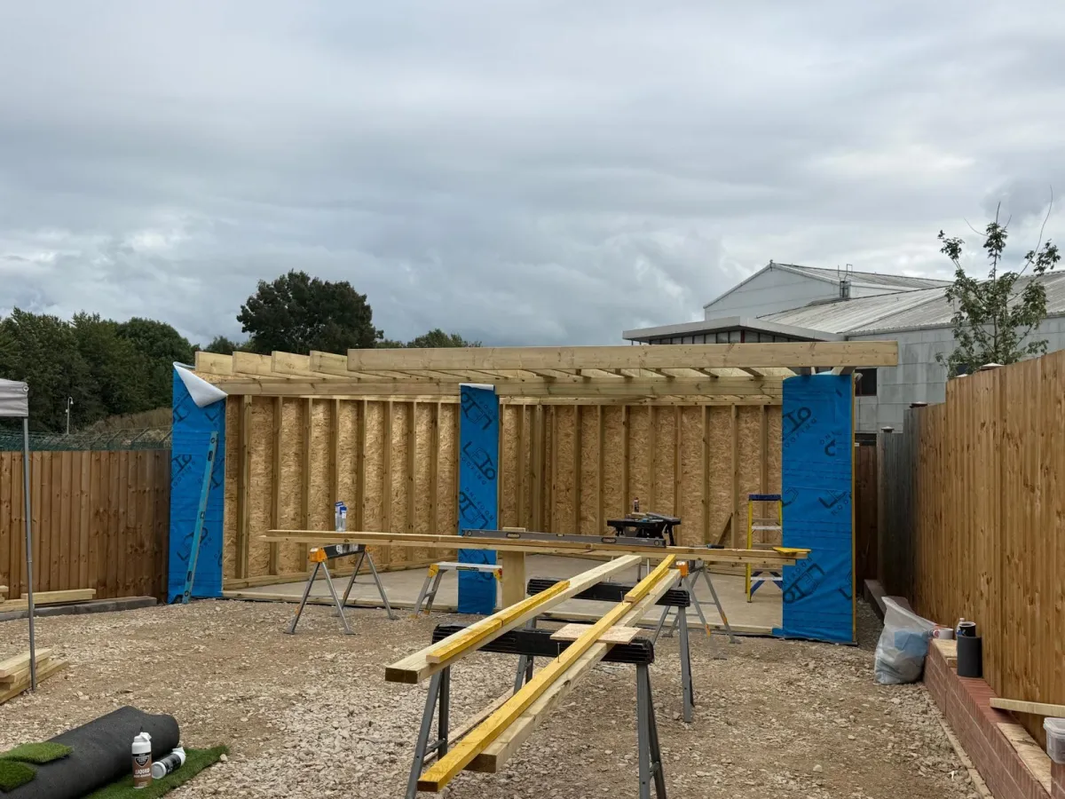Garden room timber frame being built on site in a back garden