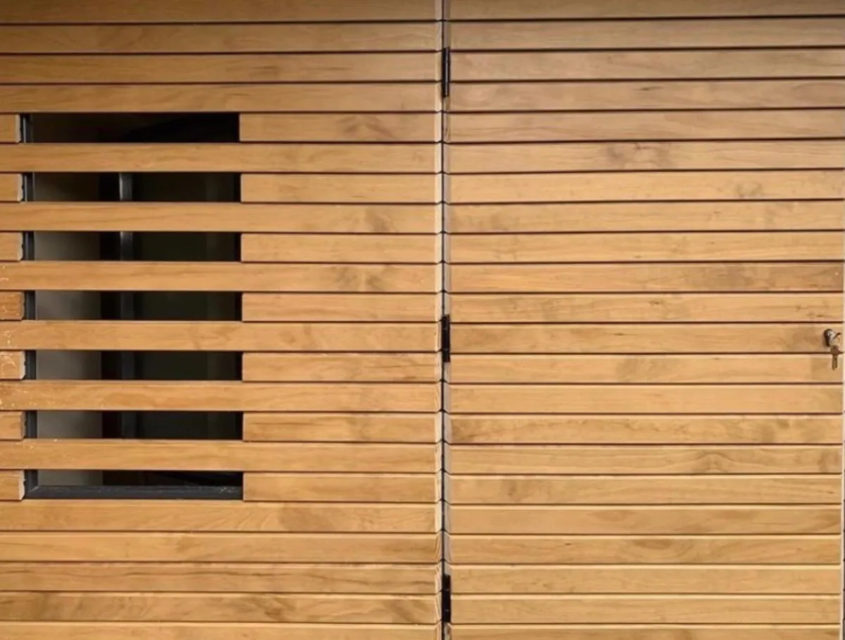 Timber-clad garden room with slatted horizontal window detail